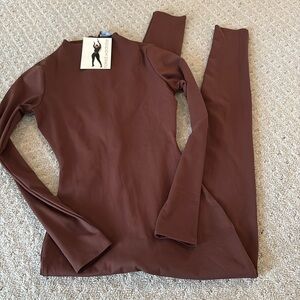 Naked Wardrobe long sleeve mock neck jumpsuit NWT